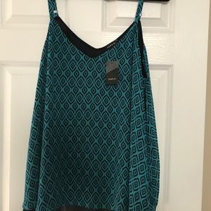 Swing tank top